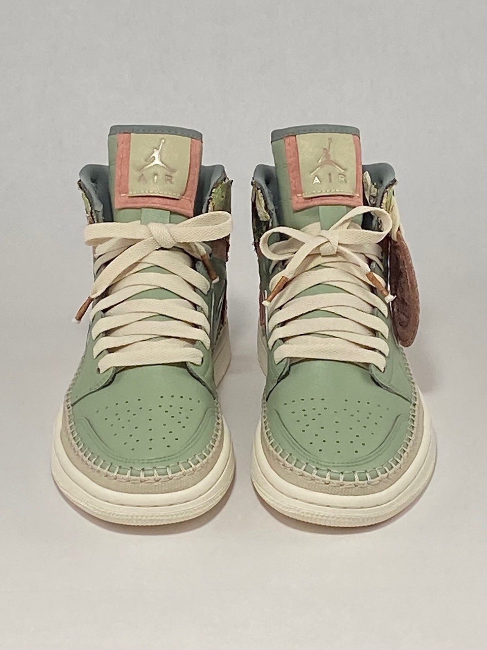 Front view of custom painted green tapestry shoes.